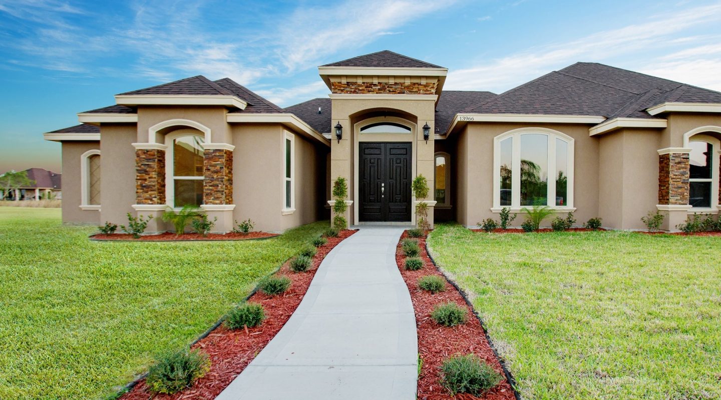 New home in McAllen TX with green yard