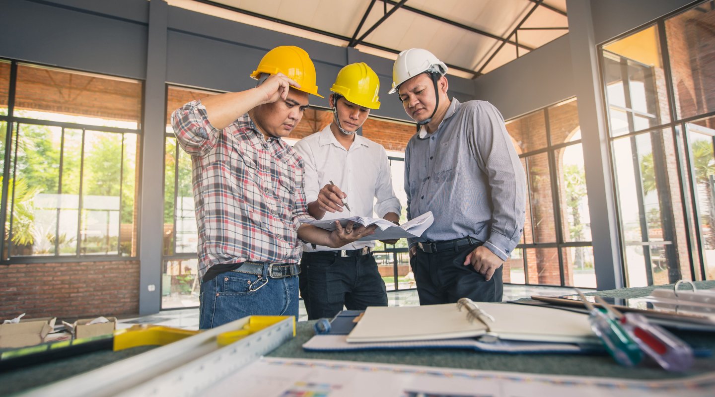 Business man and construction engineer. business, building, teamwork and people concept.