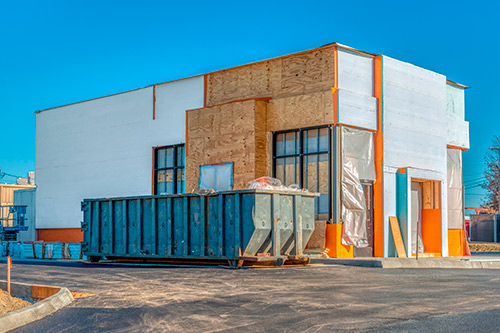 A construction site featuring a building in progress, highlighting McAllen's commercial development impact.